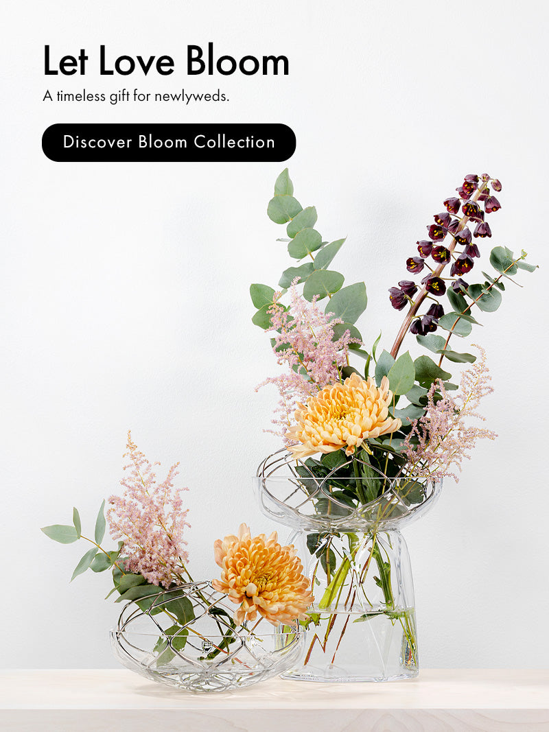Bloom Collection short and tall vases with floral arrangement on a wood surface with neutral background with text Let Love Bloom.